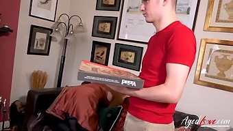 Old And Young Couple Engage In Pizza-Themed Role Play
