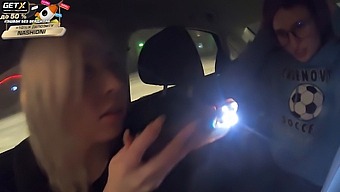 Kira Viburn And Emma Korti Give Each Other Oral Pleasure In A Car Under The Watchful Eye Of Traffic Police